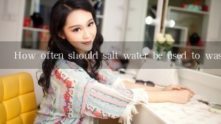 How often should salt water be used to wash face?